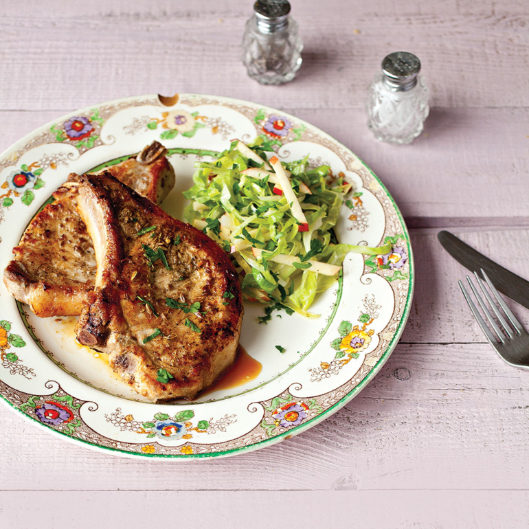Pan-fried pork chops with apple and cabbage slaw