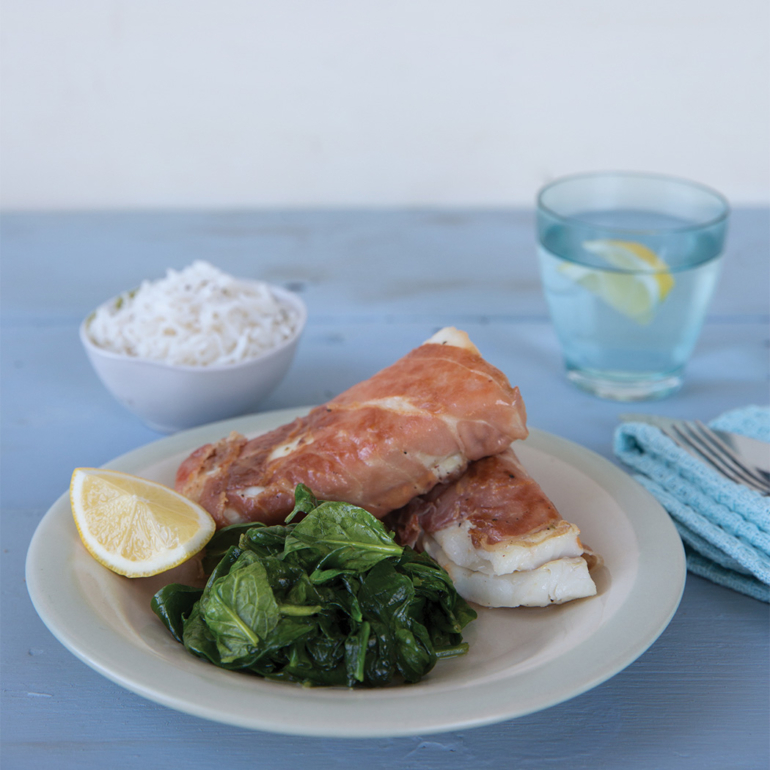 Prosciutto-wrapped cod with lemon spinach
