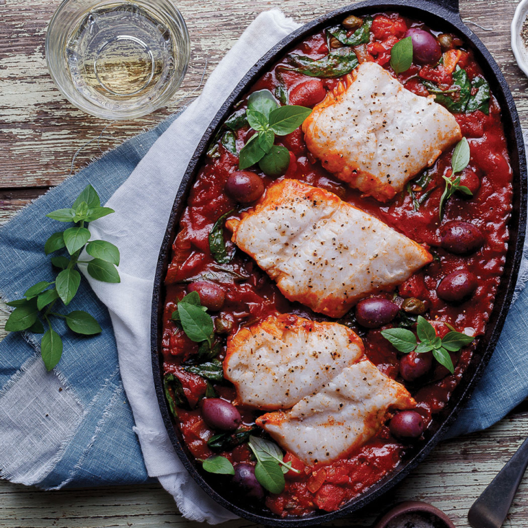Spicy tomato-poached fish with olives