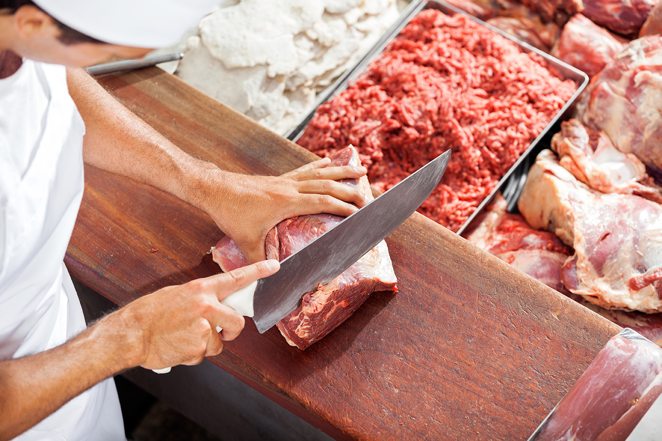 Butcher portioning meat Easy Food