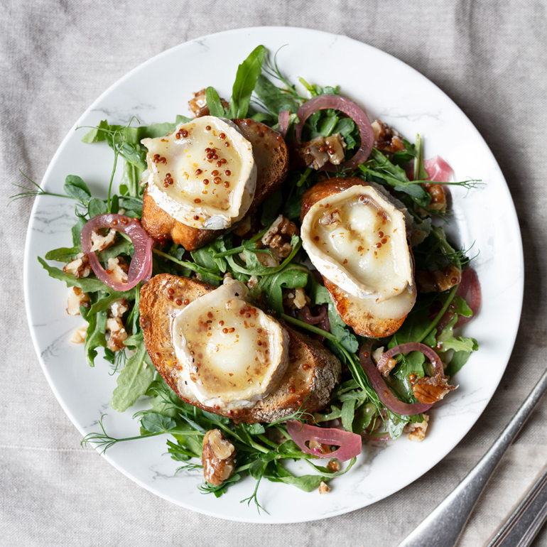 Grilled goat’s cheese salad with honeyed pecans