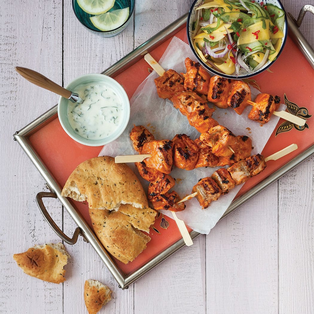 Salmon tikka skewers with mango cucumber salad recipe | easyFood