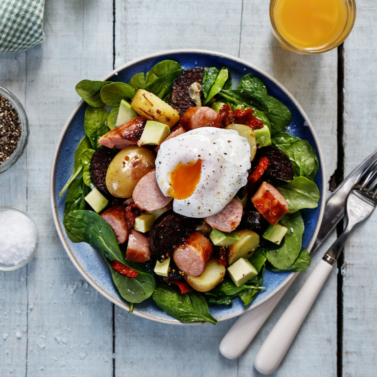 Warm breakfast salad bowls with poached eggs