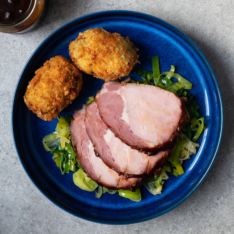 Bacon with mustard marmalade glaze and cabbage croquettes