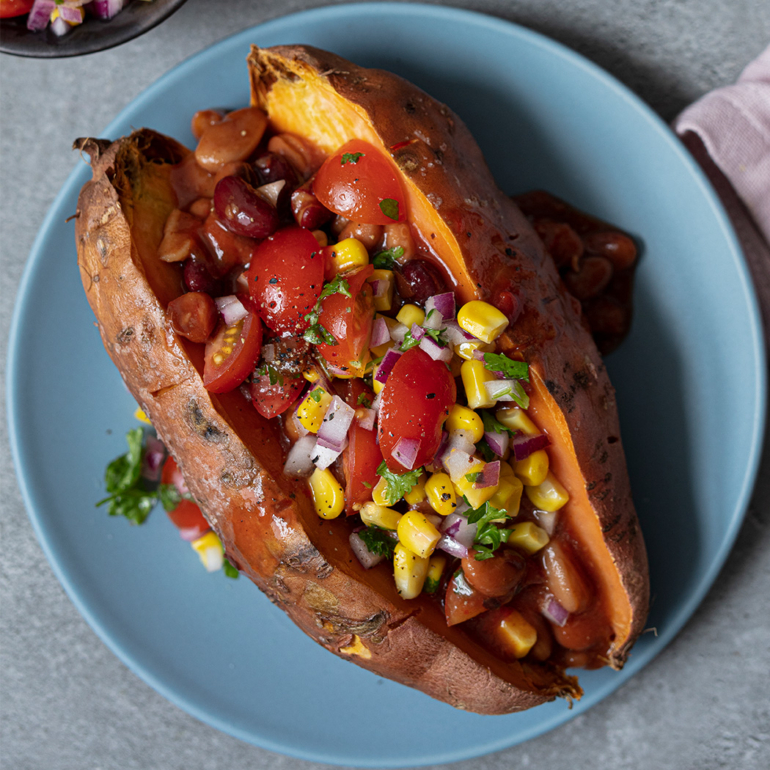 Baked sweet potatoes with spicy beans