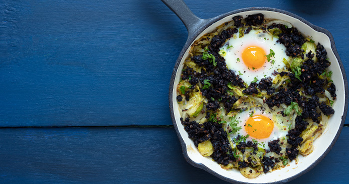 Sprout and black pudding hash with baked eggs