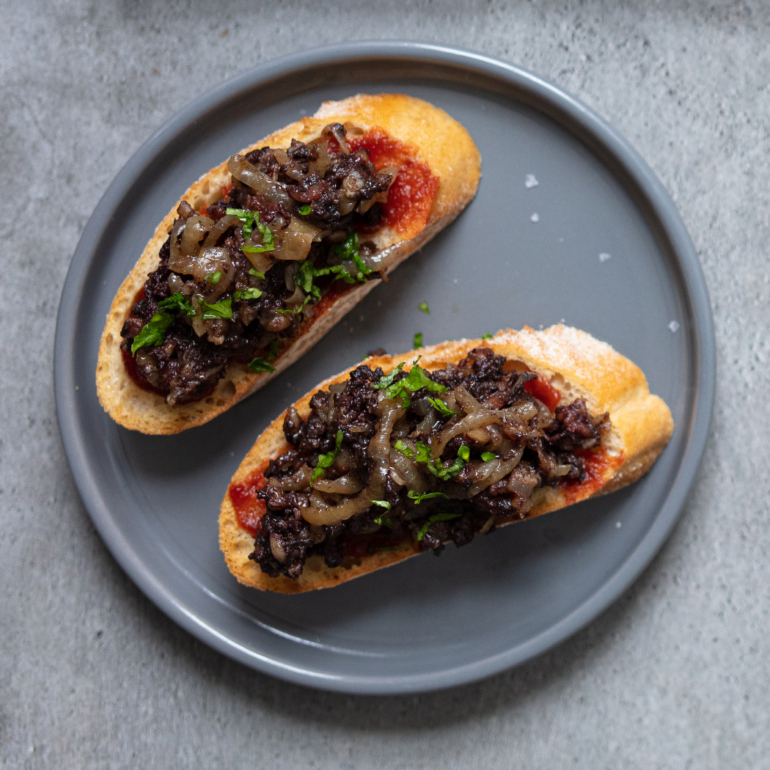 Black pudding toasts  with caramelised onions