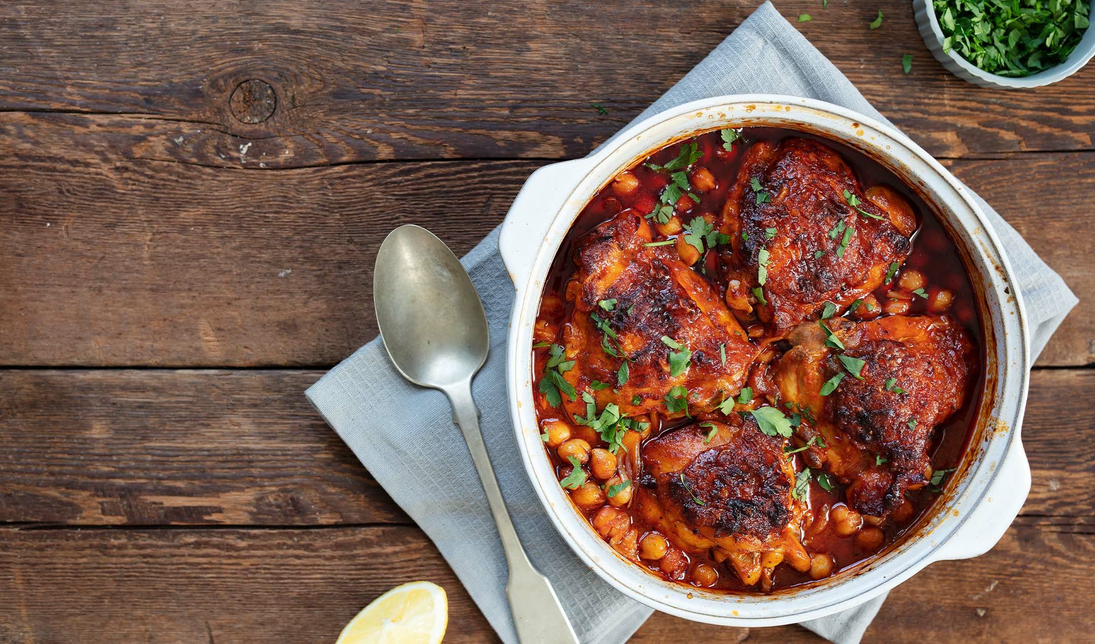 Chicken thighs with harissa and chickpeas recipe | easyFood