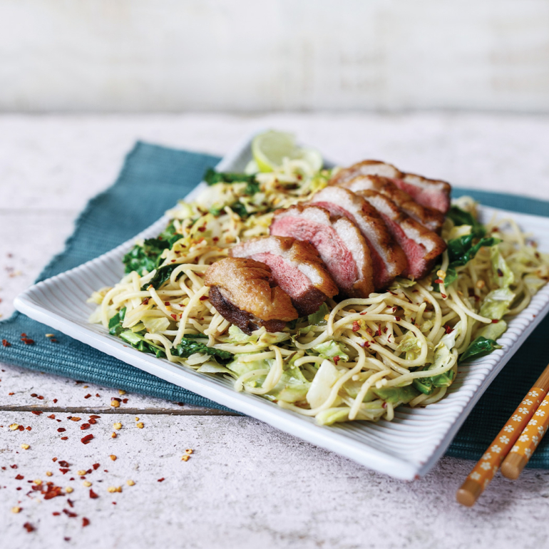 Duck with stir-fried cabbage and noodles