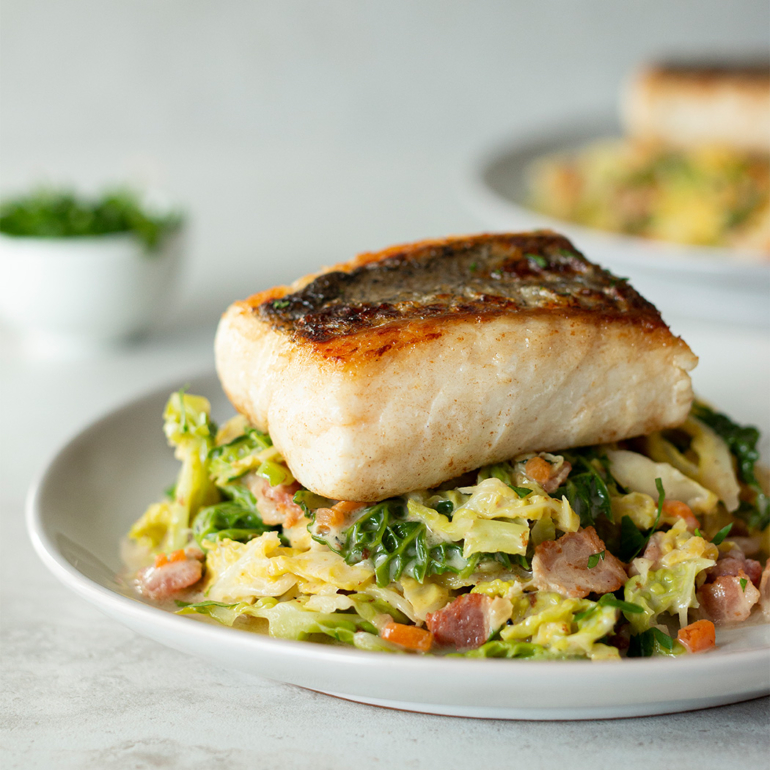 Hake with creamy bacon and cabbage