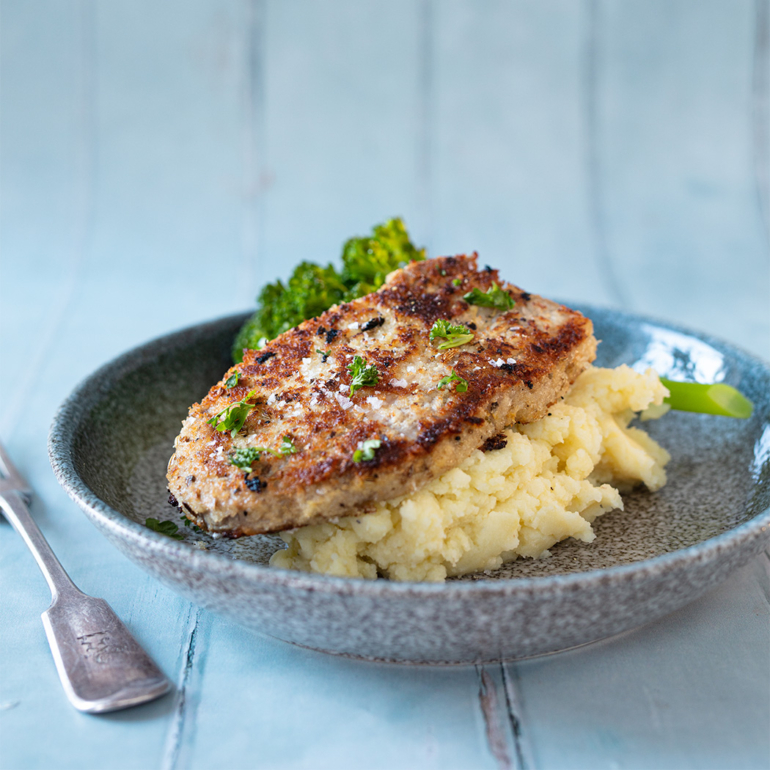 Herb crumbed pork with potato and apple mash