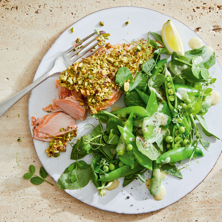 Roasted salmon with pistachios and pea tendrils