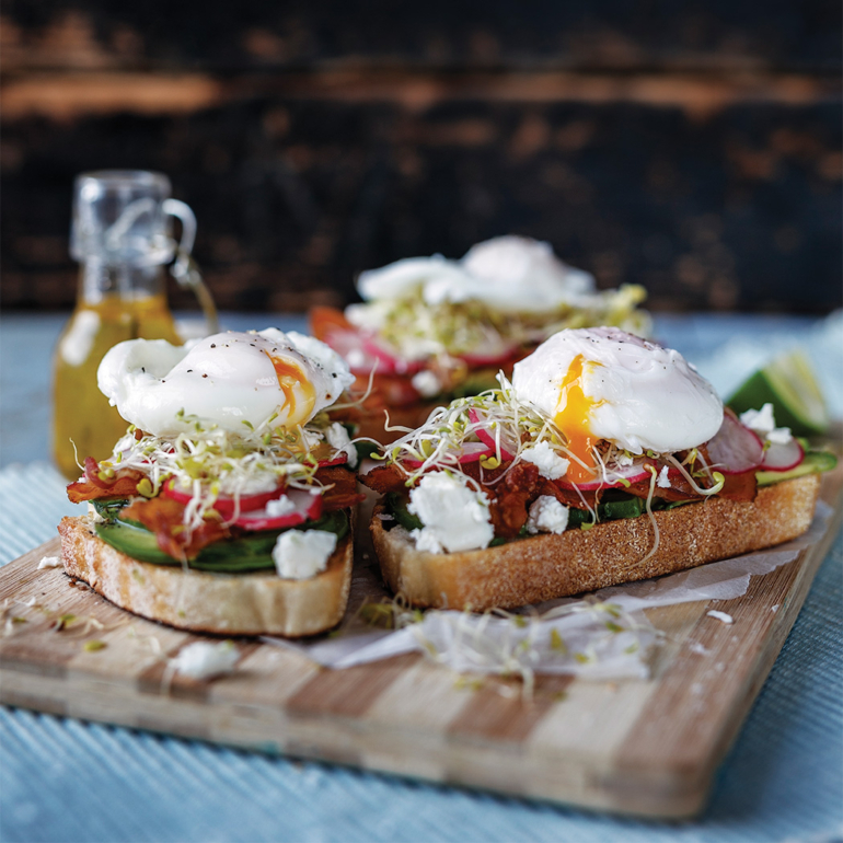 Smashed avocado toasts with Feta, bacon, and poached eggs