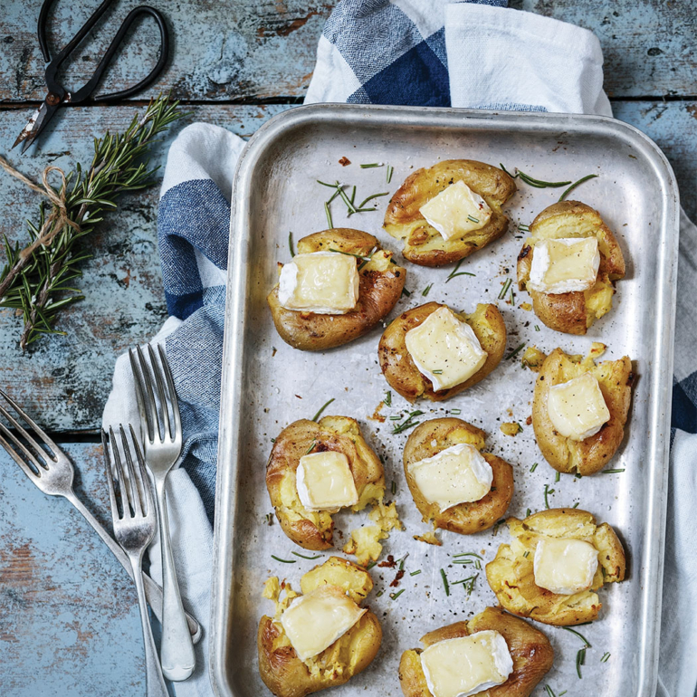 Smashed spuds with gooey Brie and rosemary
