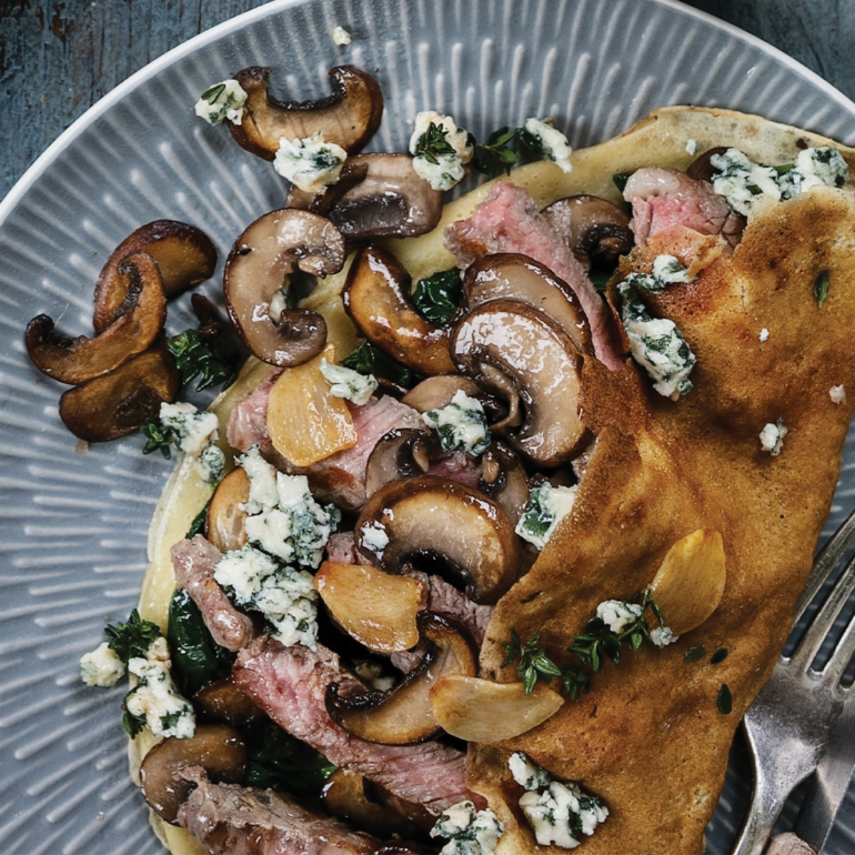 Steak, mushroom and blue cheese pancakes with balsamic glaze