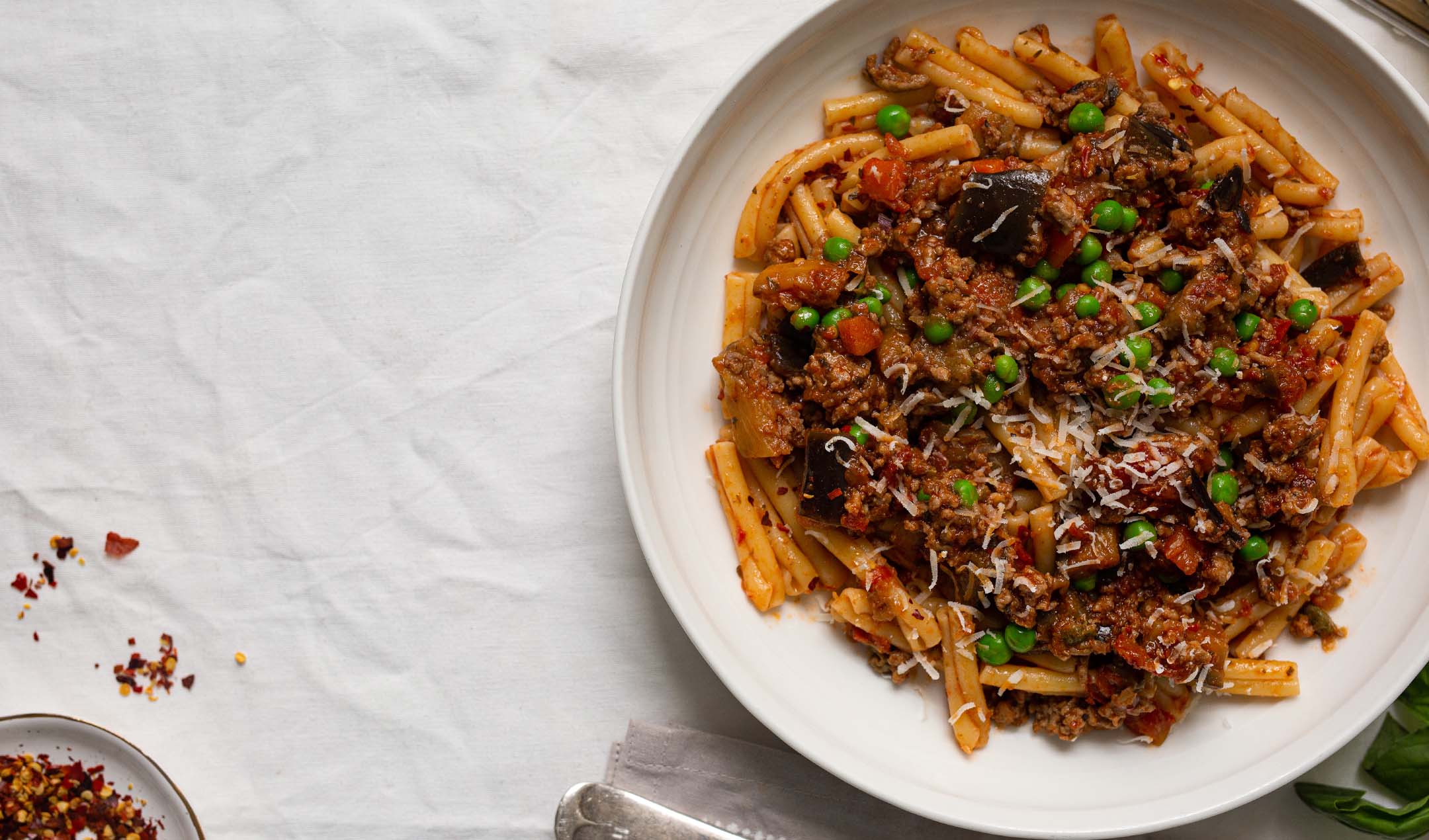 Spicy lamb, aubergine & pea bolognese