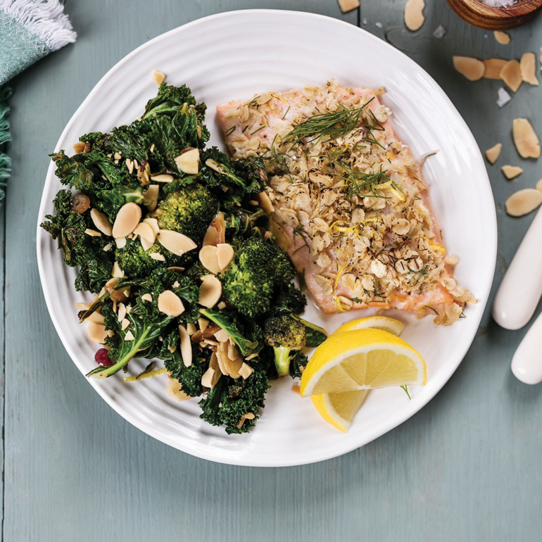 Baked oat-crusted sea trout with sautéed greens and almonds